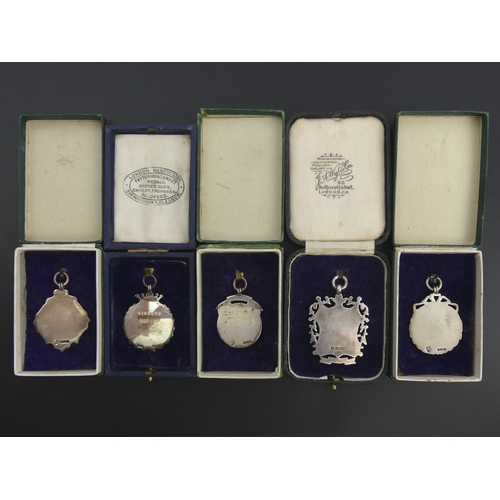 207 - Four silver and enamel boxed, local interest, fobs and a silver fob, Birm. 1897, 62.2 grams. UK Post... 