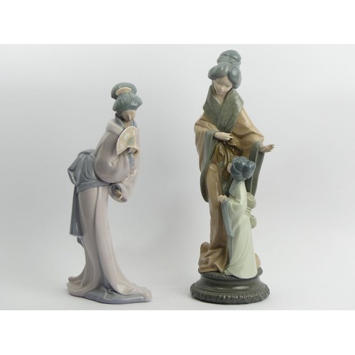 309 - Lladro porcelain figurines of oriental ladies, 38cm & 33cm. UK Postage £20.