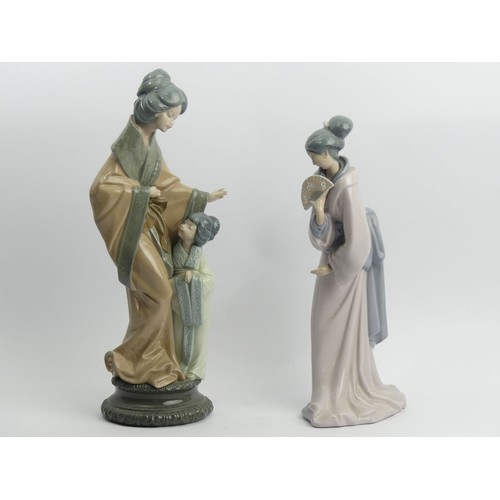 309 - Lladro porcelain figurines of oriental ladies, 38cm & 33cm. UK Postage £20.