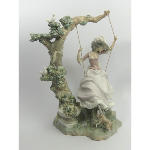 307 - Lladro porcelain figure 'Girl on a Swing' model 1297, 40cm. Collection Only