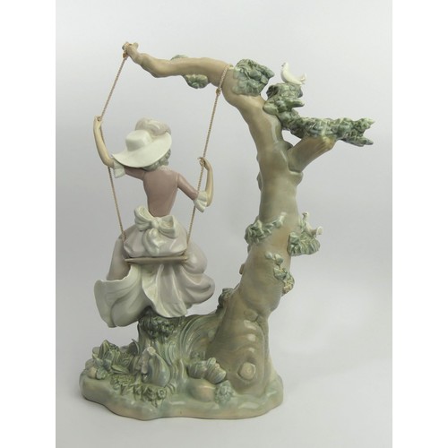 307 - Lladro porcelain figure 'Girl on a Swing' model 1297, 40cm. Collection Only