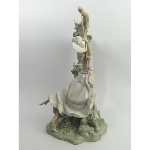 307 - Lladro porcelain figure 'Girl on a Swing' model 1297, 40cm. Collection Only