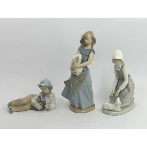 311 - Three Nao porcelain figurines of children and animals, tallest 26cm. UK Postage £18.