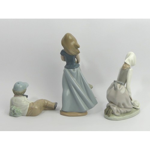 311 - Three Nao porcelain figurines of children and animals, tallest 26cm. UK Postage £18.