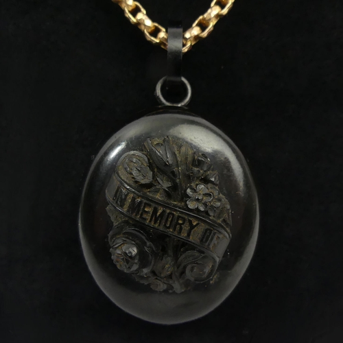 15 - Victorian vulcanite and jet memorial locket and rolled gold chain, 22.7 grams, locket 49mm, chain 41... 