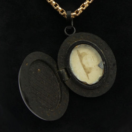 15 - Victorian vulcanite and jet memorial locket and rolled gold chain, 22.7 grams, locket 49mm, chain 41... 