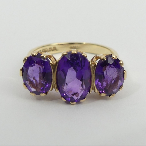 18 - 9ct gold amethyst three stone ring, 3.6 grams, 10.5mm, size O.UK  Postage £12.