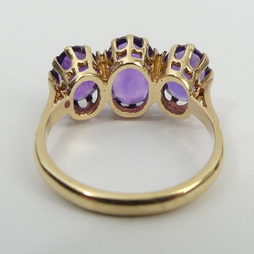 18 - 9ct gold amethyst three stone ring, 3.6 grams, 10.5mm, size O.UK  Postage £12.