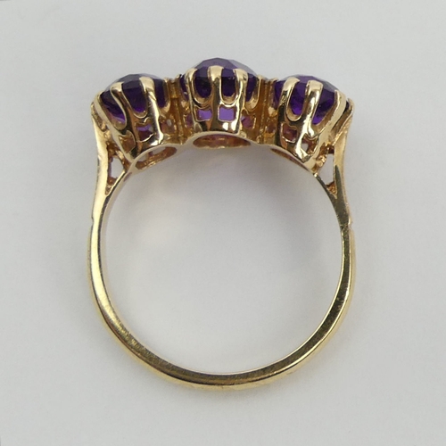 18 - 9ct gold amethyst three stone ring, 3.6 grams, 10.5mm, size O.UK  Postage £12.