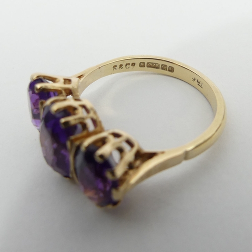 18 - 9ct gold amethyst three stone ring, 3.6 grams, 10.5mm, size O.UK  Postage £12.