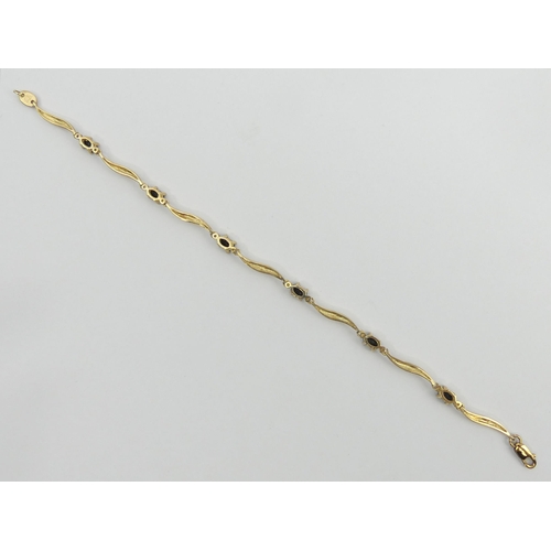 19 - 9ct gold sapphire and diamond bracelet, 4.3 grams, 18.5cm, 4.4mm wide. UK Postage £12.