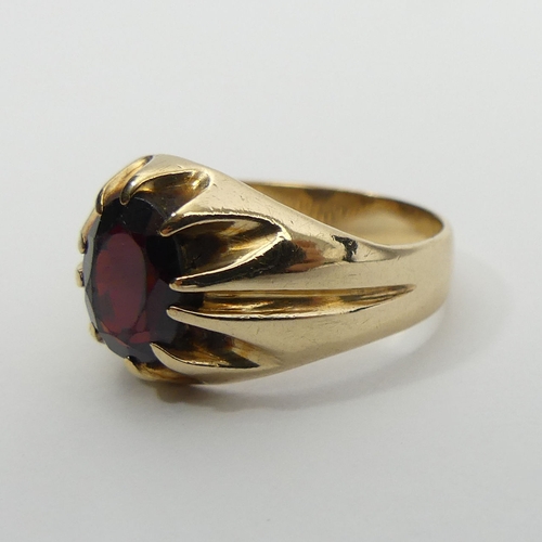 4 - 9ct gold garnet single stone ring, London 1976, 4.4 grams, 12.7mm, size Q. UK Postage £12.