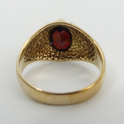 4 - 9ct gold garnet single stone ring, London 1976, 4.4 grams, 12.7mm, size Q. UK Postage £12.