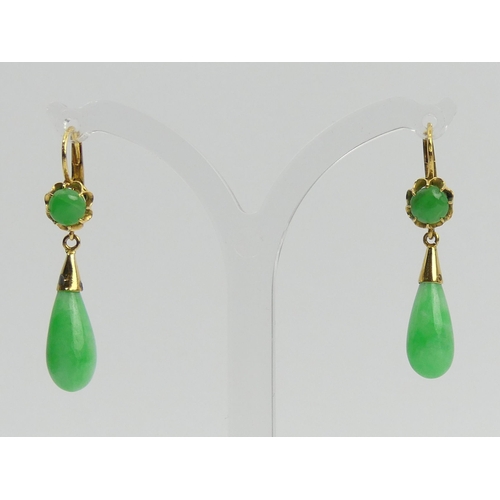 25 - A pair of 18ct gold (tested) jade drop earrings and a matching pendant, 5.5 grams. UK Postage £12.