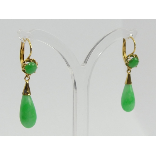 25 - A pair of 18ct gold (tested) jade drop earrings and a matching pendant, 5.5 grams. UK Postage £12.