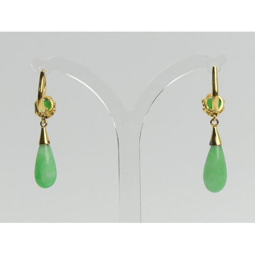 25 - A pair of 18ct gold (tested) jade drop earrings and a matching pendant, 5.5 grams. UK Postage £12.