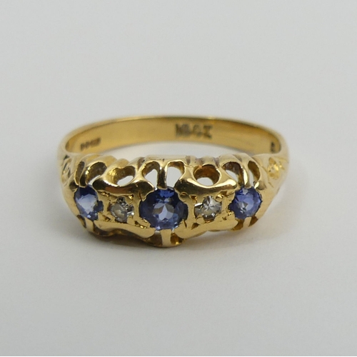 30A - 18ct gold three stone sapphire and diamond ring, 3.1 grams, 6.9mm, size O. UK postage £12.