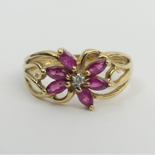 32 - 9ct gold ruby and diamond ring, 2.2 grams, 9.3mm, size M. UK Postage £12.