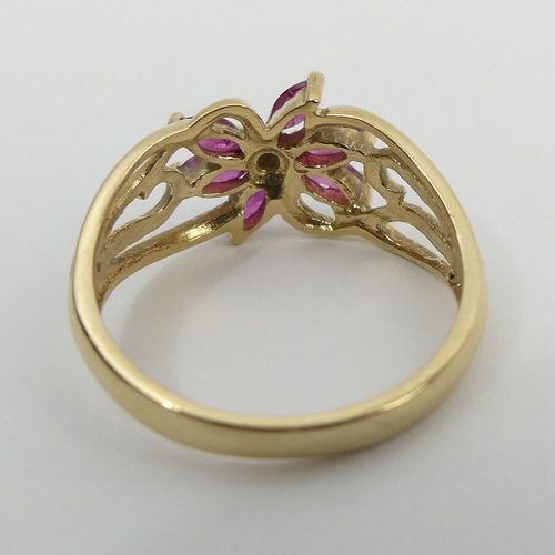 32 - 9ct gold ruby and diamond ring, 2.2 grams, 9.3mm, size M. UK Postage £12.