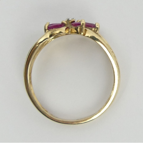 32 - 9ct gold ruby and diamond ring, 2.2 grams, 9.3mm, size M. UK Postage £12.