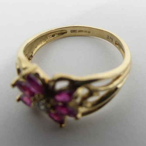 32 - 9ct gold ruby and diamond ring, 2.2 grams, 9.3mm, size M. UK Postage £12.