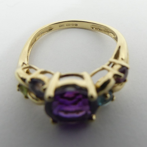 33 - 9ct gold amethyst, ruby, topaz, sapphire and peridot ring, 3 grams, 8mm, size M. UK Postage £12.