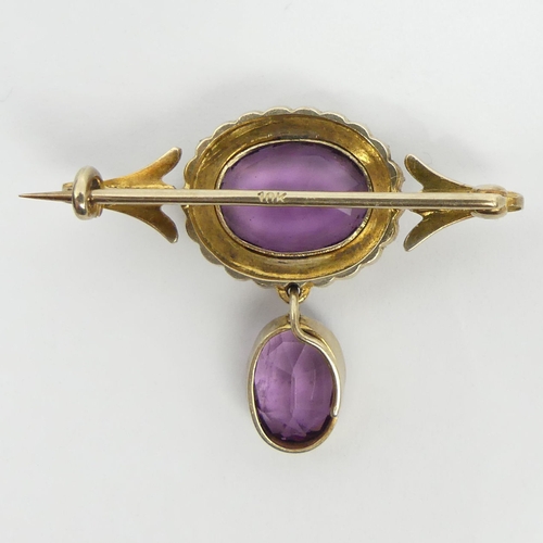 36 - 10ct gold amethyst and seed pearl brooch, 5.1 grams, 25mm x 26mm. UK Postage £12.