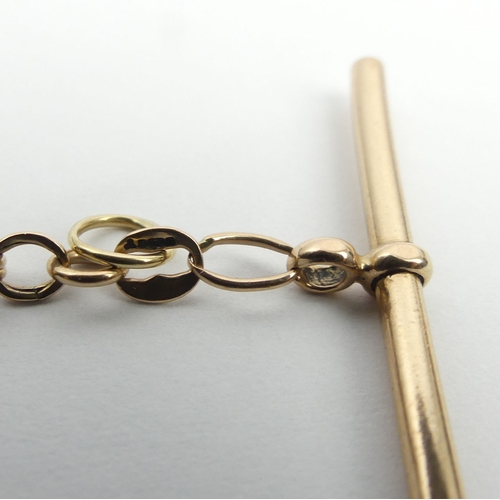 37 - 9ct gold T-bar and clip bracelet, 4.9 grams. UK Postage £12.