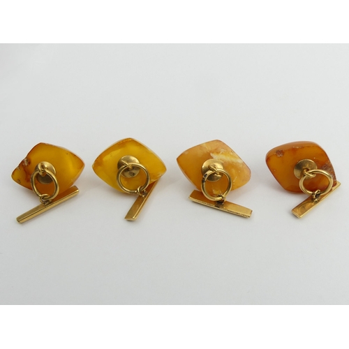 39 - Two pairs of Russian silver gilt amber set cufflinks, 18.8 grams. 28mm. UK Postage £12.