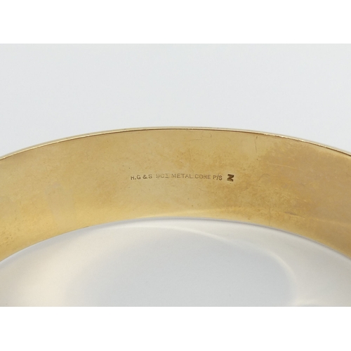 40A - 9ct gold metal core hinged bangle, 42.4 grams. UK Postage £12.