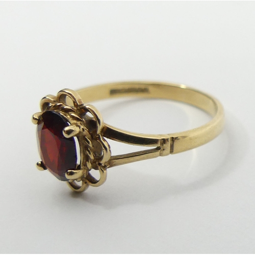 44 - 9ct gold single stone garnet ring, 1.6 grams, 10.2mm, size M. UK Postage £12.