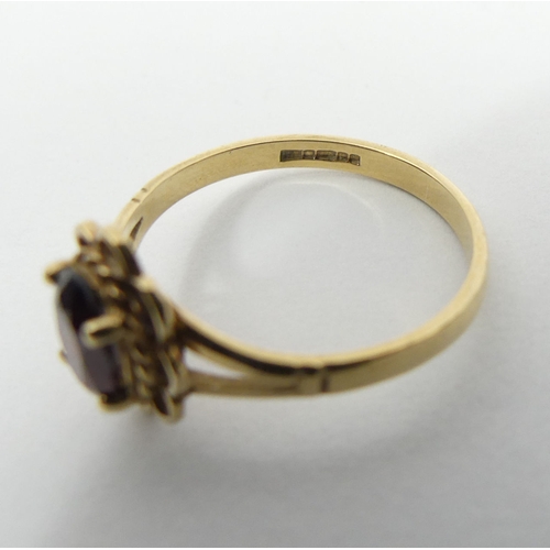 44 - 9ct gold single stone garnet ring, 1.6 grams, 10.2mm, size M. UK Postage £12.