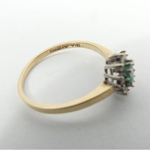 45 - 9ct gold emerald and diamond ring, 1.7 grams, 9.3mm, size N 1/2. UK Postage £12.