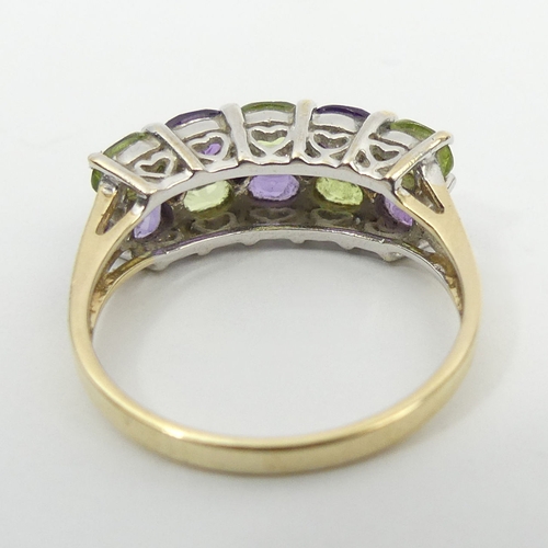 48 - 9ct gold peridot, amethyst and diamond ring, 2.4 grams, 6.6mm, size M 1/2. UK Postage £12.