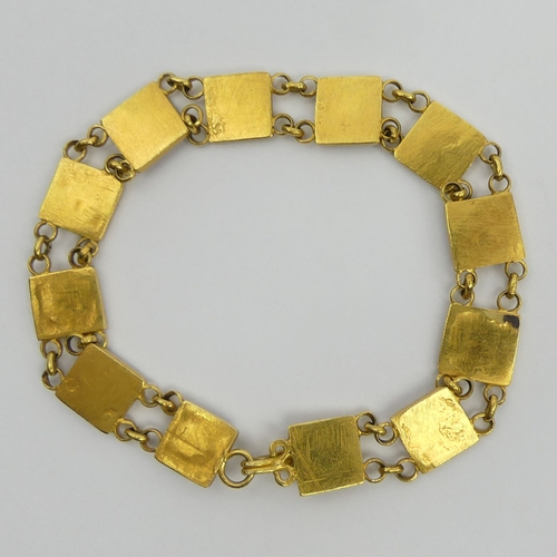 51 - 14ct gold tested zodiac design bracelet, 14 grams. UK Postage £12.