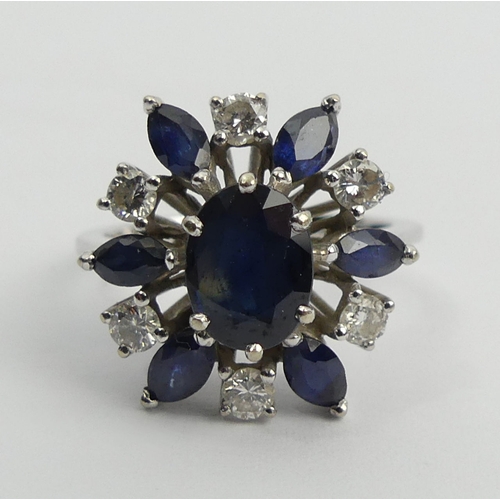 61 - 18ct white gold sapphire and diamond cluster ring, 4.7 grams, 15.5mm, size J 1/2. UK Postage £12.