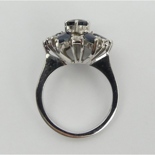 61 - 18ct white gold sapphire and diamond cluster ring, 4.7 grams, 15.5mm, size J 1/2. UK Postage £12.