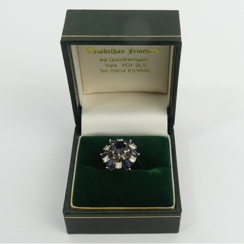 61 - 18ct white gold sapphire and diamond cluster ring, 4.7 grams, 15.5mm, size J 1/2. UK Postage £12.