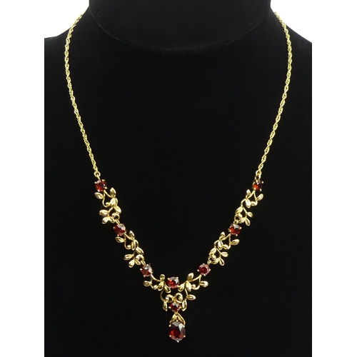 62 - 9ct gold garnet necklace, 14.4 grams, 43cm. UK Postage £12.