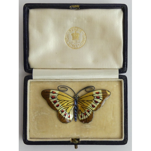 68 - An old leather clad jewellery box and contents including a silver and enamel butterfly brooch and a ... 