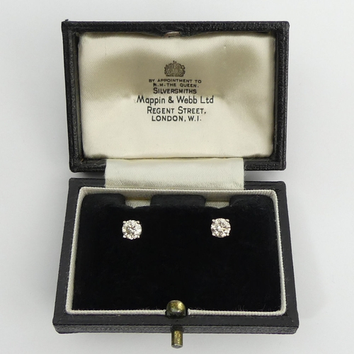 69 - A pair of 18ct gold diamond stud earrings approx 1ct, 1.5 grams, 5mm dia. UK Postage £12.