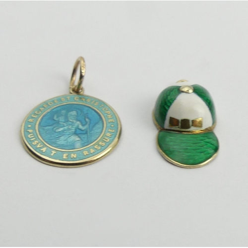 70 - 9ct gold jockeys cap, decorated in green and white enamel and a 9ct St Christopher pendant decorated... 