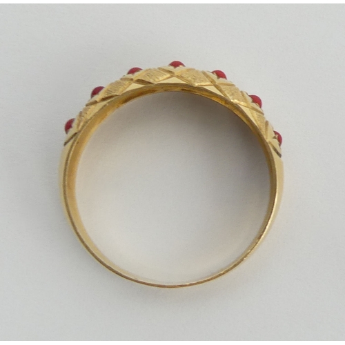 71 - 18ct gold seven stone coral ring, 2.1 grams, 8mm, size Q. UK Postage £12.