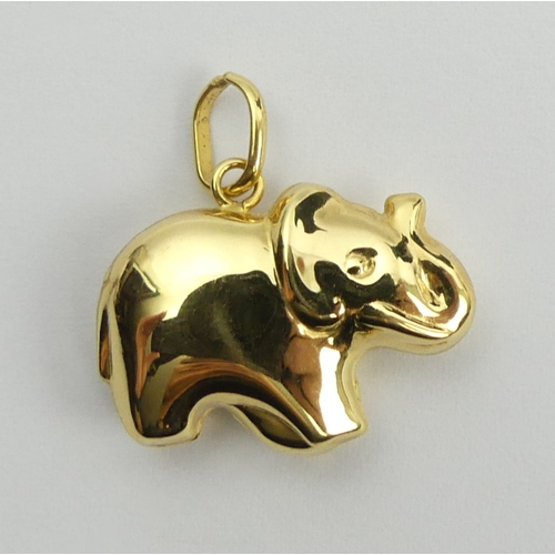 74 - 9ct gold lucky elephant pendant, 1.6 grams, 21mm. UK Postage £12.