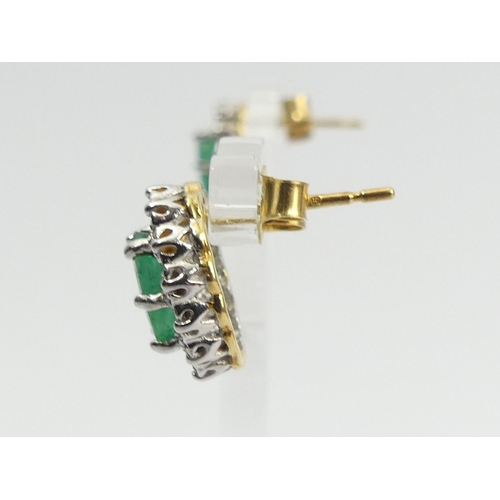 82 - A pair of 18ct gold emerald and diamond earrings, 3.7 grams, 12mm x 10mm.  UK Postage £12.