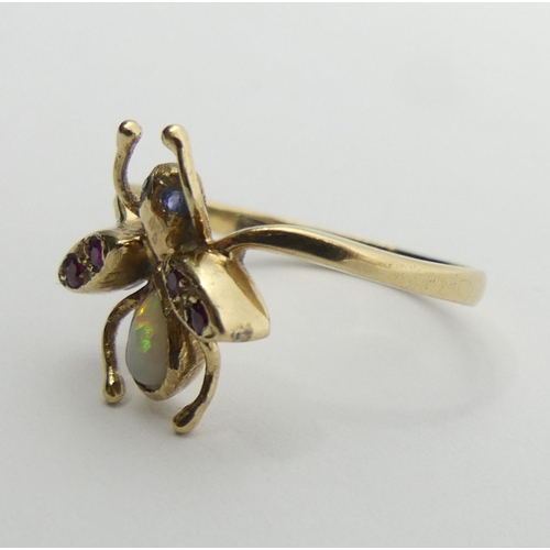 88 - 9ct gold opal, ruby and sapphire fly/bug ring, 2 grams, 15mm, size N. UK Postage £12.