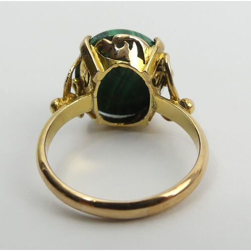 89 - 14ct gold malachite set ring, 4 grams, 14mm, size M1/2. UK Postage £12.