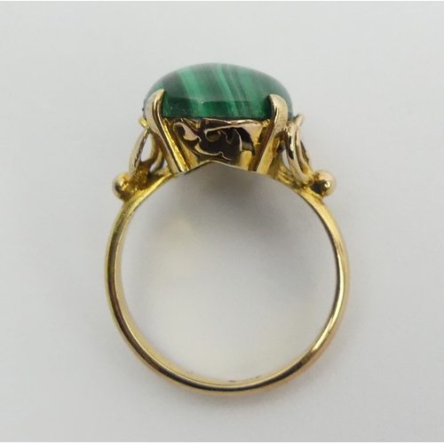 89 - 14ct gold malachite set ring, 4 grams, 14mm, size M1/2. UK Postage £12.