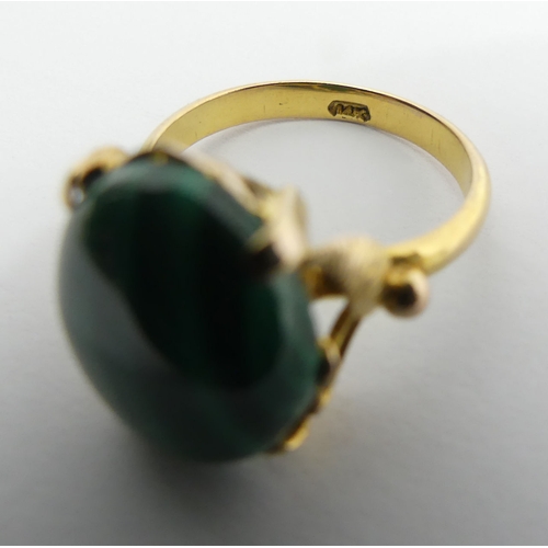 89 - 14ct gold malachite set ring, 4 grams, 14mm, size M1/2. UK Postage £12.