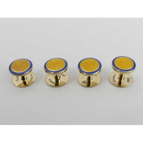 99 - A set of 9ct gold and enamel cufflinks and dress studs in a fitted box. Birm. 2006, 25
3 grams.  UK ... 